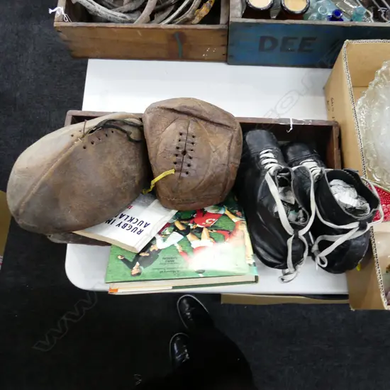WOODEN CRATE OF OLD RUGBY BOOTS, BALLS & BOOKS