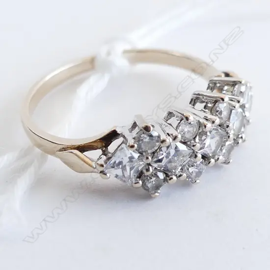 9CT RING WITH 18 CZ STONES SIZE L