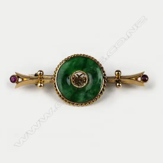 An 18ct gold jade and ruby bar brooch