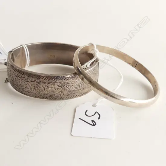 TWO SILVER HINGED BANGLES