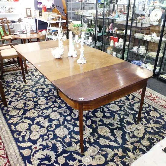 MAHOGANY EARLY 19THC D END EXTENDING TABLE.  TWO EXTENSION LEAVES ( EACH 570mm WIDE ) TABLE 530mm WIDE . BRASS CLIPS INC