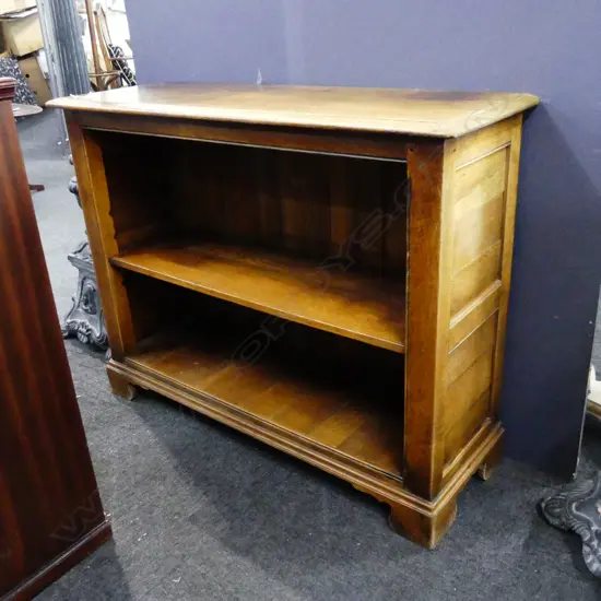 OAK TWO TIER PANELLED BOOKCASE. ON SOFT OGEE BRACKET FEET. H. 770mm