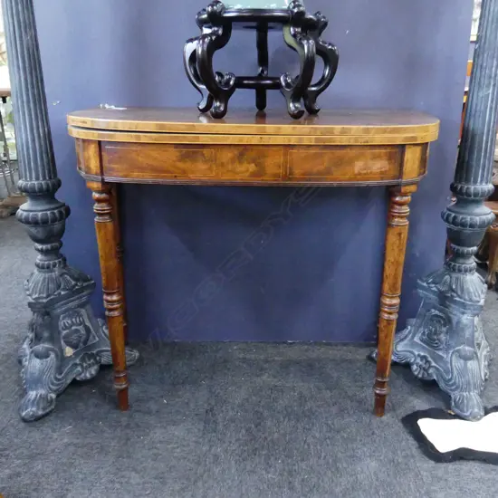 VICTORIAN FLAME MAHOGANY FOLDOVER DEMI-LUNE TEA TABLE WITH SWING OUT LEGS. L. 910mm EXTENDED 900MM SQ