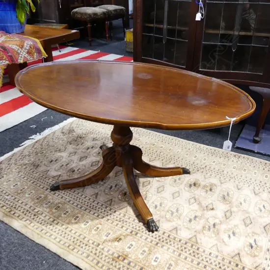 OVAL MAHOGANY COFFEE TABLE WITH BRASS CLAW FEET L.1020MM