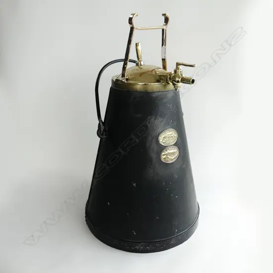 COLONIAL IRON & POLISHED BRASS 'MILKER' BY Smart Brothers Stratford, New Plymouth & Inglewood H.680mm.