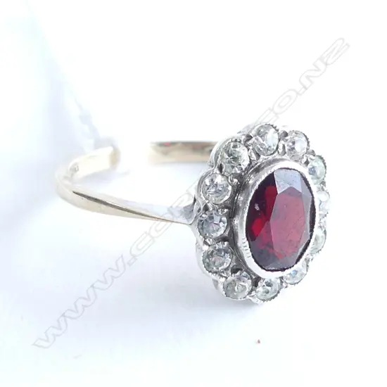 9CT/SILVER SETTING GARNET AND WHITE STONES (PASTE) CLUSTER RING. **RTV**