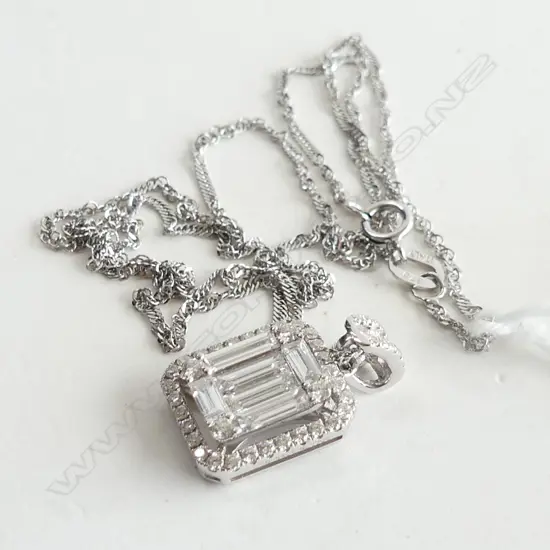 18CT WHITE GOLD & DIAMOND PENDANT ON 9CT CHAIN 3gms