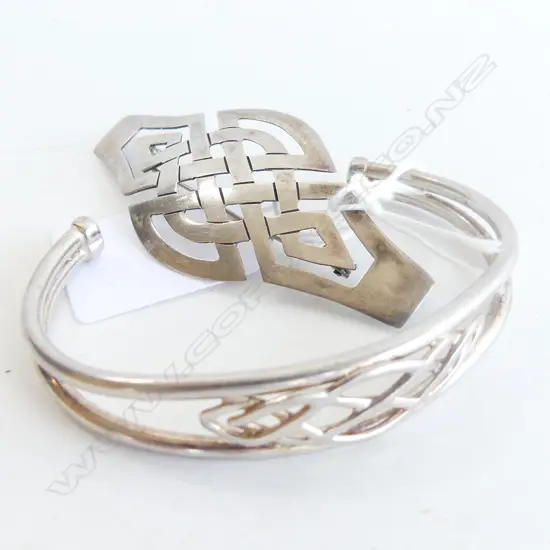 SILVER BROOCH AND SILVER CUFF WITH CELTIC DESIGNS