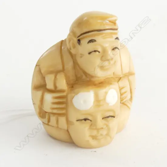 IVORY NETSUKE MAN WITH MASK H30MM