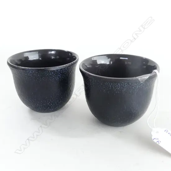 TWO JAPANESE IRON TEA CUPS