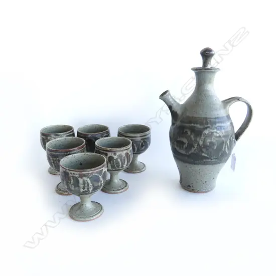 7 PCE STUDIO POTTERY WINE JUG H.270mm & 6 GOBLETS - SPIRAL MARK, WAX RESIST DECORATION