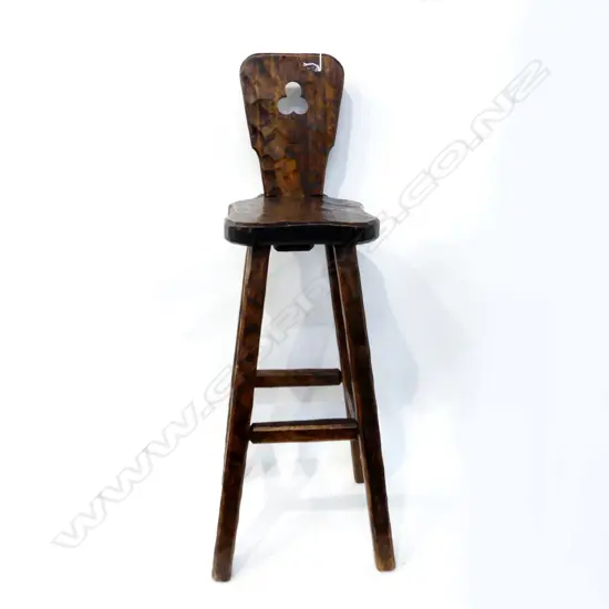 TALL BAR STOOL WITH ADZED EFFECT. IN THE MANNER OF CHAPMAN TAYLOR WITH MAKERS CYPHER TO THE UPRIGHT BACK. H.1030mm