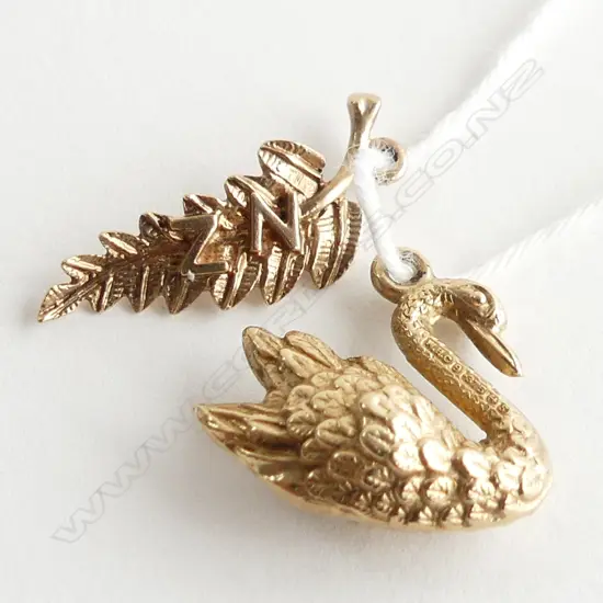 2X 9CT CHARMS: FERN LEAF W NZ + 1953 SWAN 1.6gm