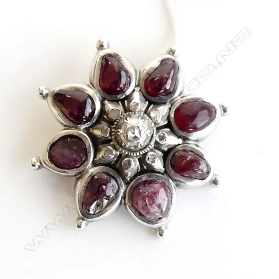 SILVER BROOCH WITH OLD MINE CUT DIAMONDS AND CABOCHON RUBIES