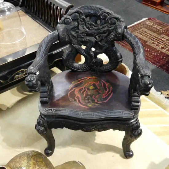 CARVED CHINESE CHAIR EBONISED FINISH (arm a bit loose)