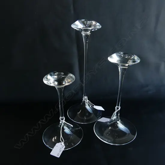 3 KOSTA BODA GLASS CANDLESTICKS ONE SIGNED. TALL OF FLARED SHAPE  H.280/200/170 mm