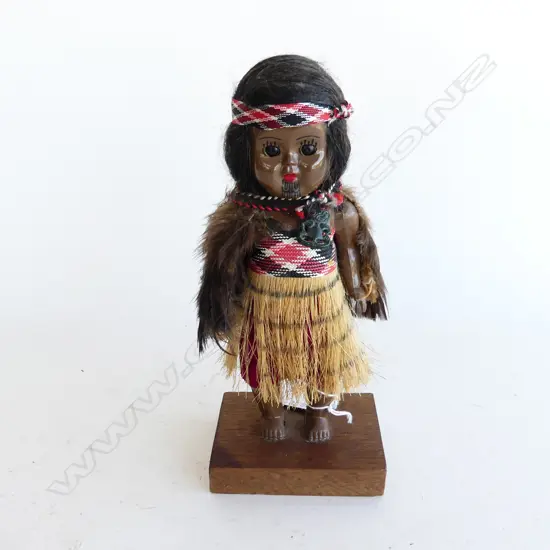 VINTAGE MAORI DOLL IN KAHU HURUHURU (FEATHER CAPE)WITH BABY H225MM W WOODEN STAND