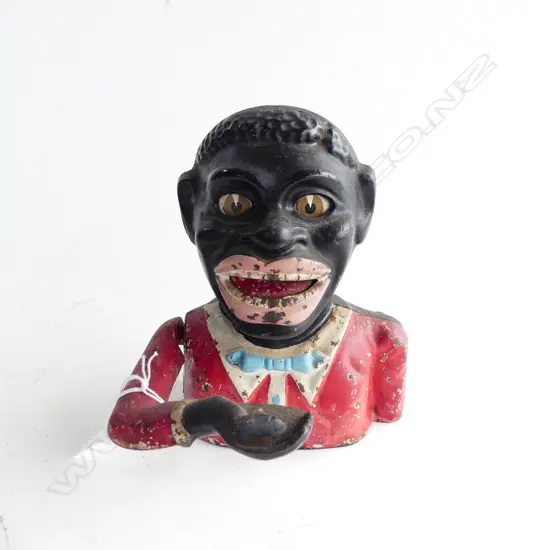 EARLY 20THC RED JACKET MONEY BOX by SYDENHAM & McOUSTRA in Walsall U.K. H.155mm