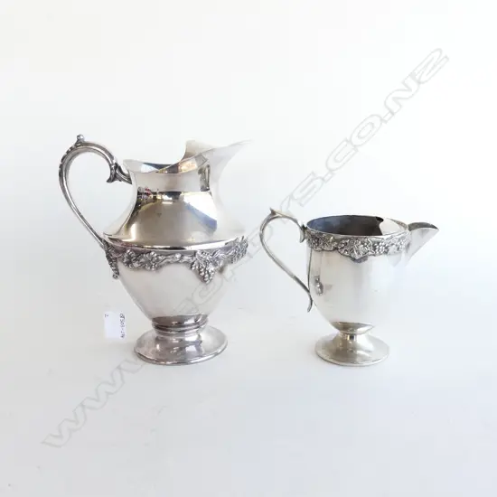 TWO SILVER PLATED WATER JUGS WITH GRAPE & VINE DECORATION H. 220MM & 135MM