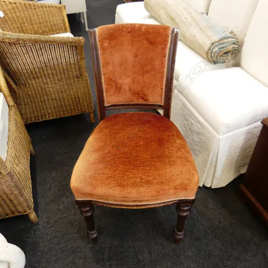RUST COLOURED UPHOLSTERED CHAIR
