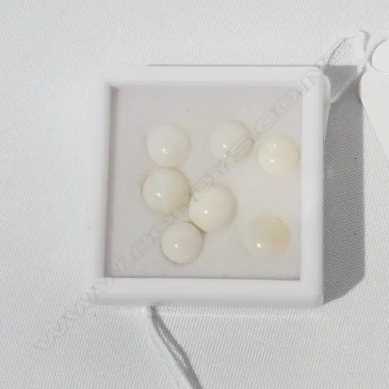 SEVEN 8CT ROUND MILKY OPALS