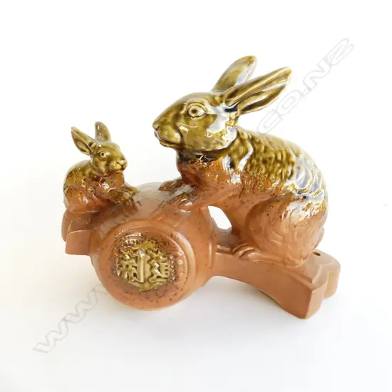 VINTAGE GREEN GLAZED POTTERY SCULPTURE 2 rabbits on a drum W.285mm