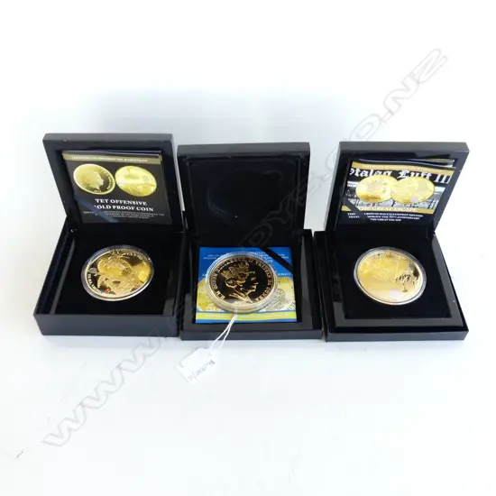 3 COMMEMORATIVE 24CT GOLD PLATED COINS; GREAT ESCAPE, CORAL SEA BATTLE, TET OFFENSIVE 70mm dia