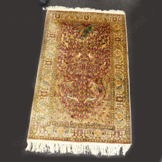 A FINELY HAND KNOTTED TURKISH RUG WITH SMALL STAIN 1670 X 1050 MM