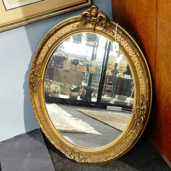 ORNATE GOLD GILDED OVAL WALL MIRROR, SOME FOXING 650 X 510MM