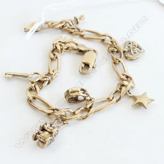 9CT GOLD CHARM BRACLET 7 CHARMS CATCH FAULTY 20.3GMS 