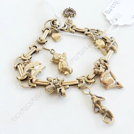 9CT GOLD CHARM BRACLET 10CHARMS 22.8GRMS