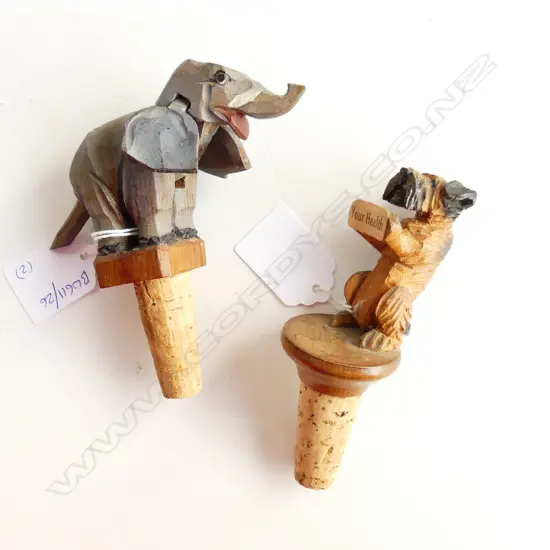 TWO ANRI MECHANICAL CARVED WOOD BOTTLE STOPPERS OF DOG & ELEPHANT, L.110MM