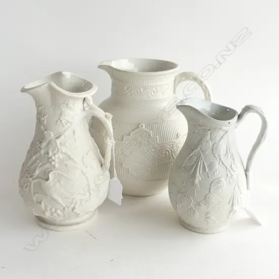 3 IVORY EMBOSSED PARIAN JUGS H. 200, 200 & 165MM