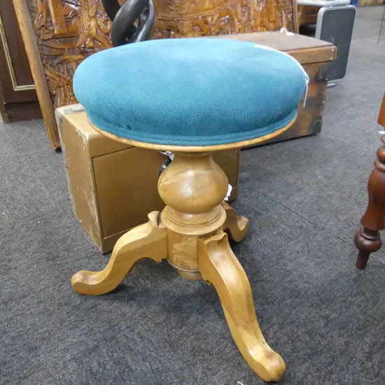 GREEN UPHOLSTERED PIANO STOOL