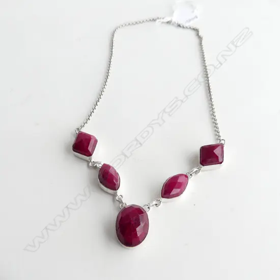 STG SILVER NECKLACE WITH 4 LG FACET CUT RUBIES ?