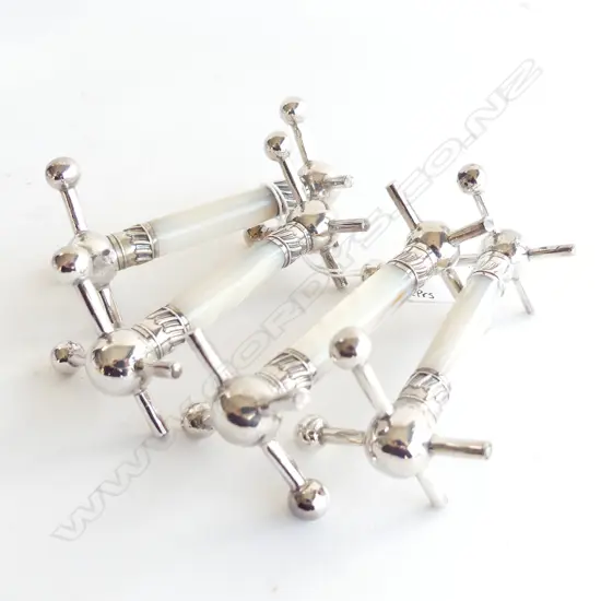 TWO PAIRS OF MOTHER OF PEARL AND SILVER PLATE KNIFE RESTS