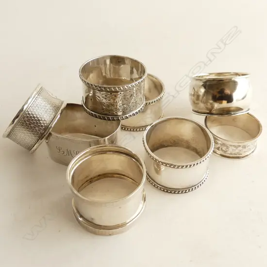 EIGHT ASSTD SILVER NAPKIN RINGS 188gm