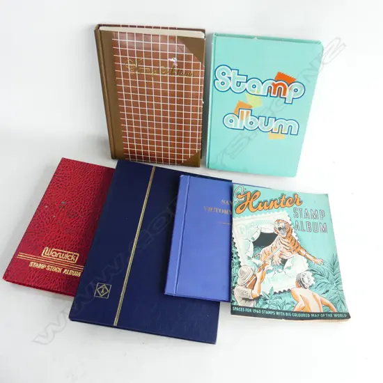 6 ALBUMS OF WORLD STAMPS INCL. 2 NZ + JERSEY ETC