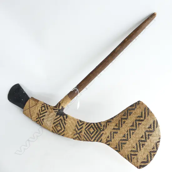 MELANESIAN STONE ADZE MOUNTED IN WOVEN CANE WITH WOOD HANDLE L770MM
