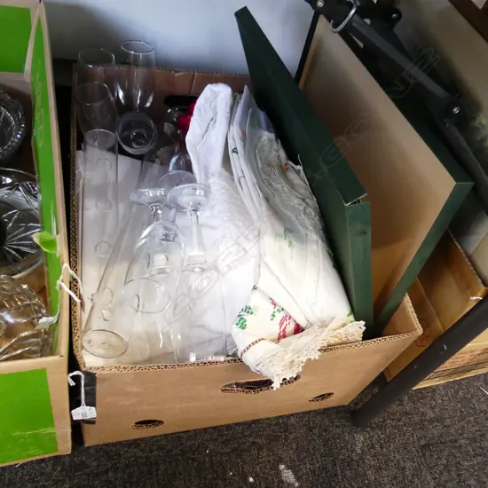 BOX LOT SILVER PLATE, CHAMPAGNE FLUTES, LINENS, PLACE MATS ETC