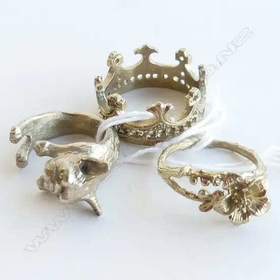 3 LOW GRADE SILVER FUN DRESS RINGS, CROWN, PUG DOG & FLOWER