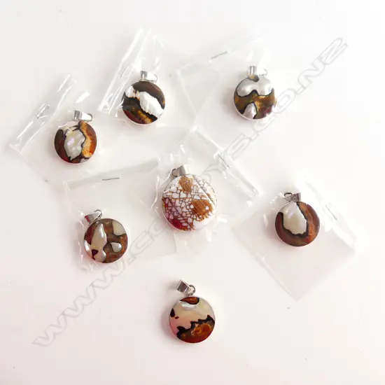 SEVEN SILVER AND SHELL PENDANTS