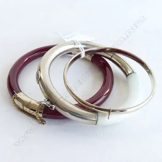 3 ORIENTAL BANGLES; CARNELIAN, WHITE JADE, GP 60mm int. dia.