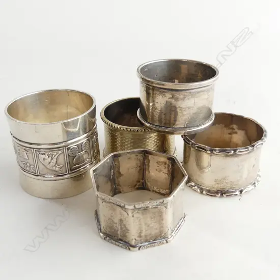 4 STG SILVER NAPKIN RINGS + 1 OTHER 107 GRAMS