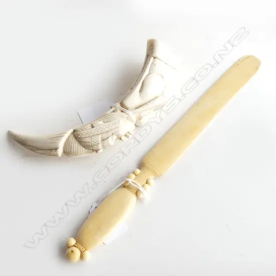 2 CARVED IVORY ITEMS. PIGS TUSK AFRICAN CARVED OF FEMALE H. 170mm & LETTER OPENER L.270mm