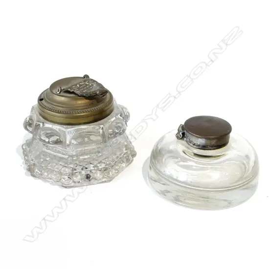 2 VINTAGE GLASS INKWELLS INCL 1 WITH BRASS LID IMPRESSED WITH ALBERT 1885 (DIA 90MM) + ONE OTHER (DIA 90MM