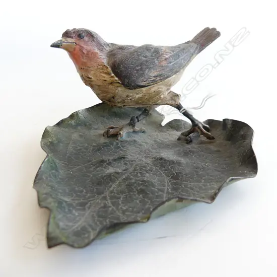 C1900 COLD PAINTED SCULPTURE BIRD ON LEAF L.170mm 1 leg faulted