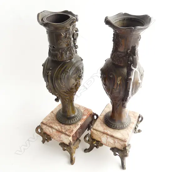 PAIR OF ' BRONZED' SPELTER URNS ON MARBLE BASES WITH FOUR FEET. ONE FAULTED MISSING ARM . H.340mm