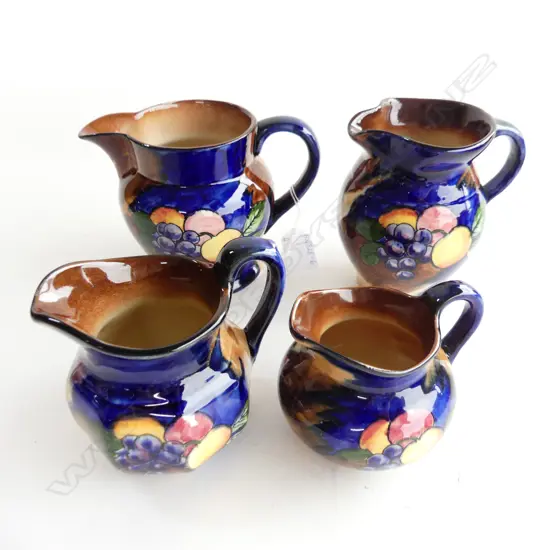 FOUR  H & K TUNSTALL AUTUMN FRUITS JUGS, VARIOUS SHAPES (H. 130, 115, 105, 90MM)