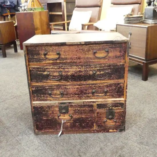 OLD JAPANESE BEDSIDE CABINET. 6 DRAWERS. RED TONING. SIDE BRACKET FEET. W. 575 D. 325 H. 580